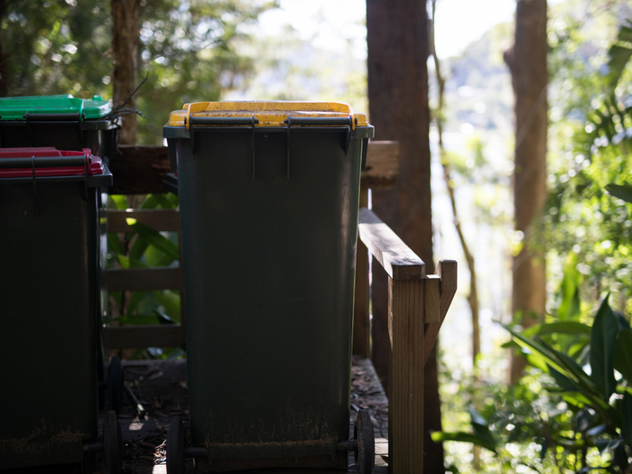 CN three Australian bins with coloured lids yellow red and green opposite